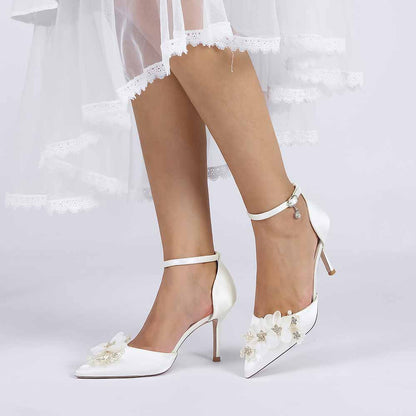 Elegant bridal satin ankle strap pumps with floral embellishments for a stylish wedding look