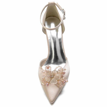 Elegant S&DCo. bridal satin point toe heels with floral embellishments and ankle strap