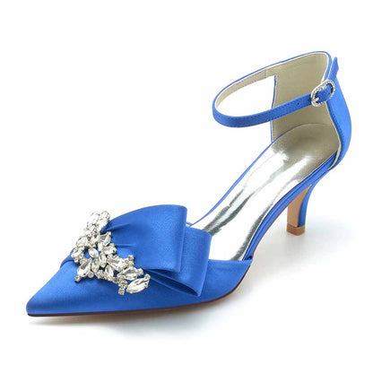 Elegant blue satin bridal shoes for the bride with jeweled bow and ankle strap