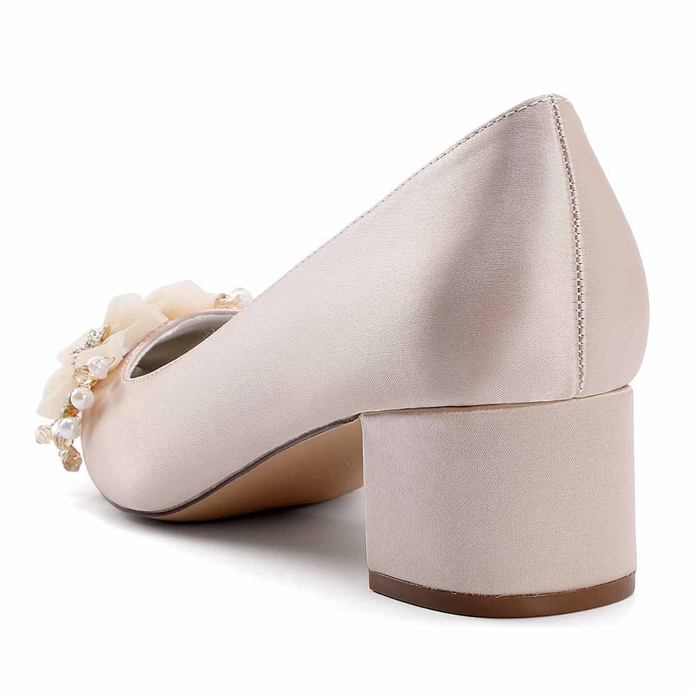 Elegant bridal heels featuring flower appliques, perfect for brides on their special day