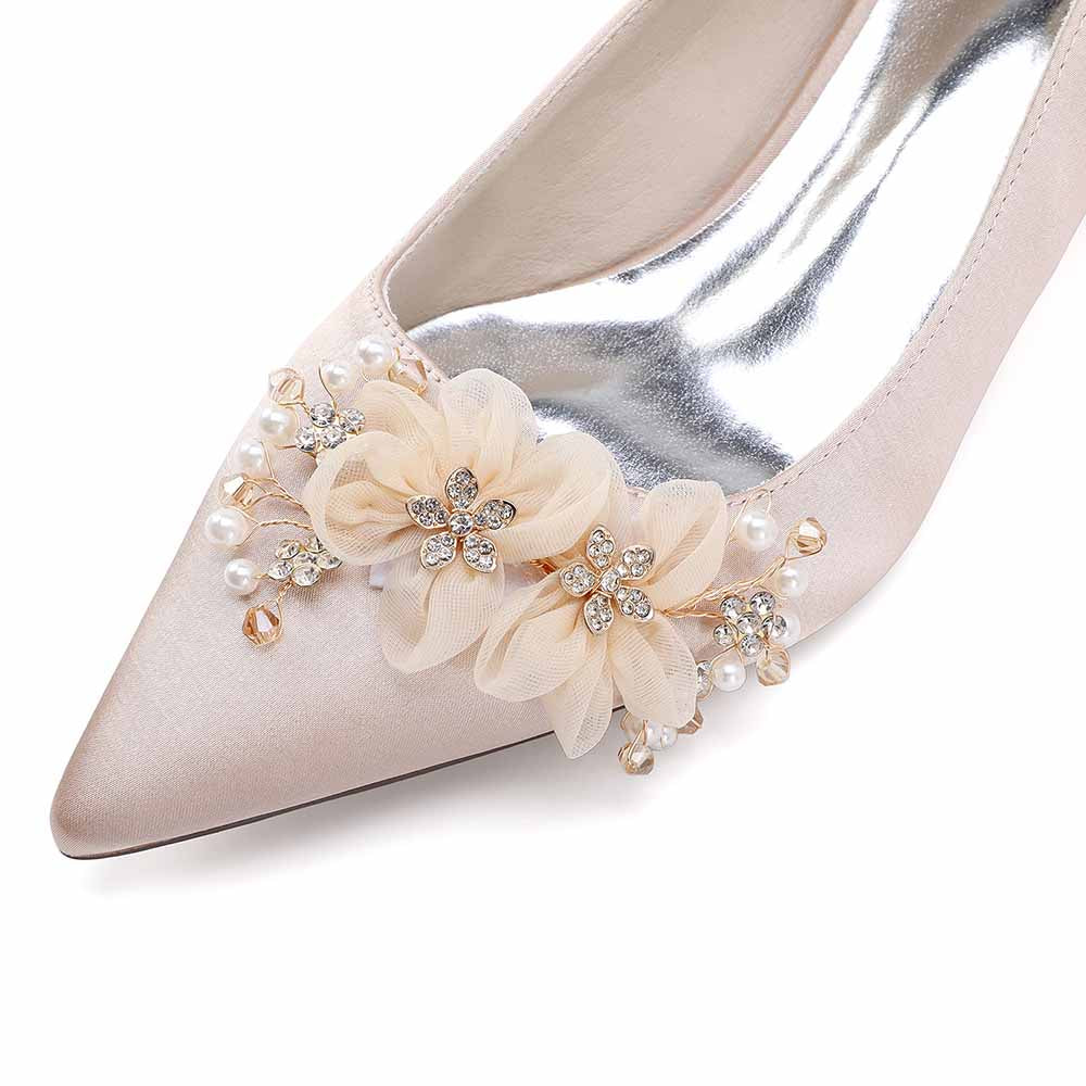 Elegant bride shoes with flower appliques featuring pearl accents for a stylish wedding look