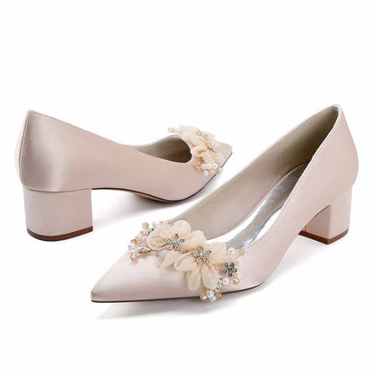 Elegant bridal heels with flower appliques designed for brides on their special day