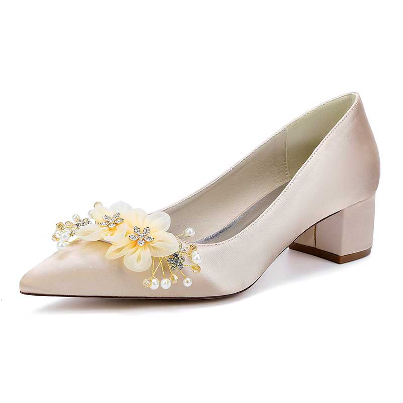 Elegant bride shoes with flower appliques in soft satin for a stylish bridal look