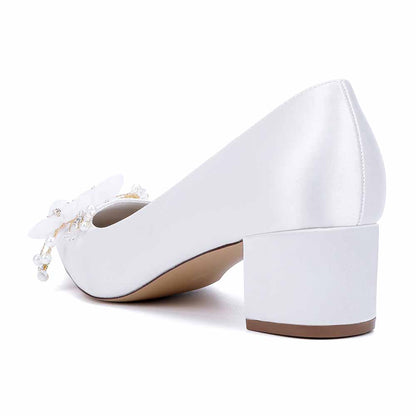 Elegant white bride shoes with flower appliques and a comfortable block heel for the perfect wedding look