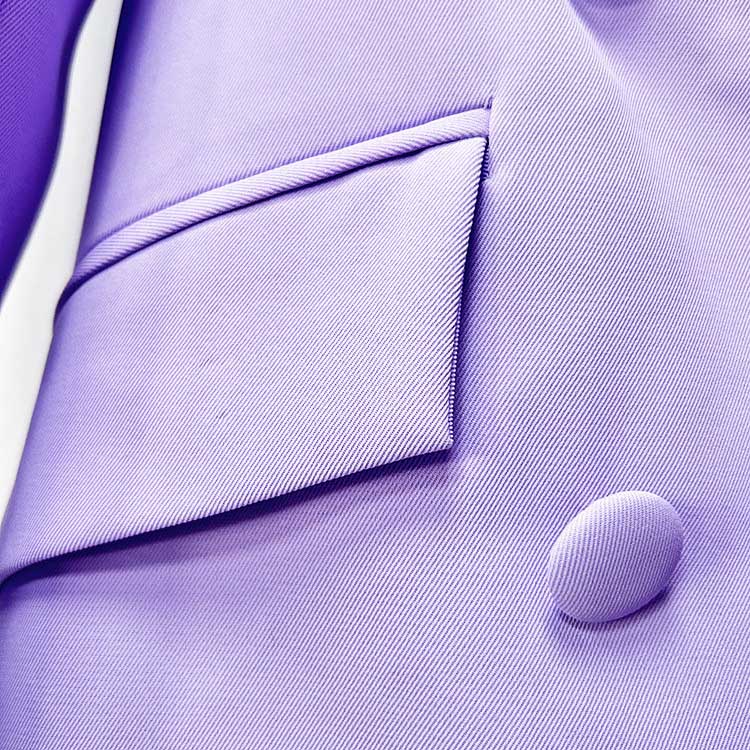 Close-up of a bridesmaid lavender pantsuit set showcasing the fabric texture and pocket detail