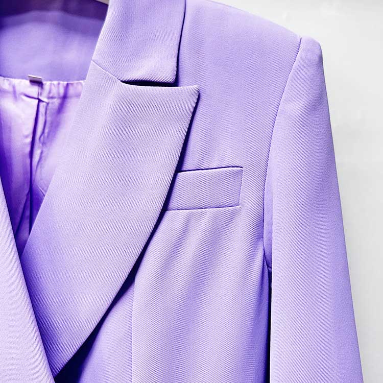 Close-up of a bridesmaid lavender pantsuit set highlighting the elegant lapel and tailored design