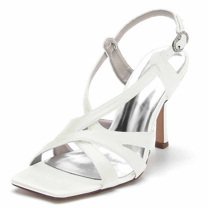 Elegant white satin bridesmaid sandals with a stylish crisscross design and a small heel