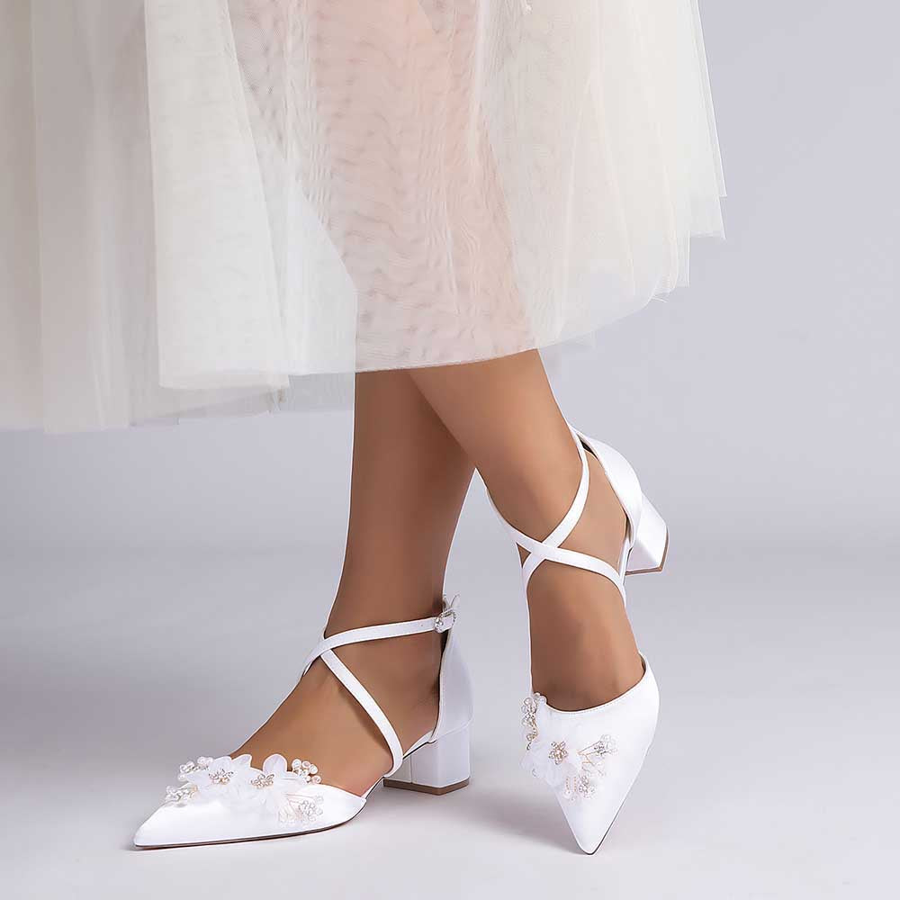 Elegant white bridesmaid shoes with flower detail and ankle strap for special occasions