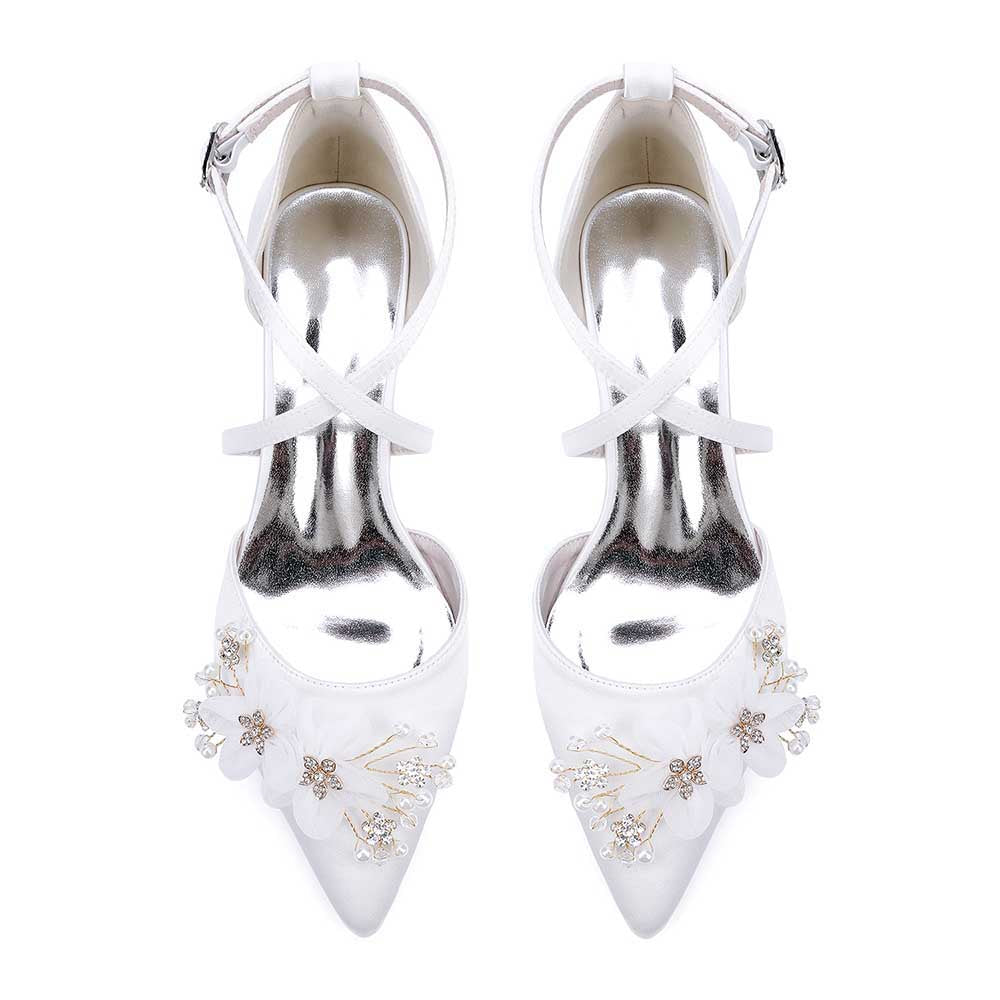 Elegant white heels as bridesmaid shoes with flower detail and ankle strap for special occasions