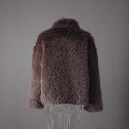 Brown faux fur short jacket with a plush texture, ideal for stylish winter layering