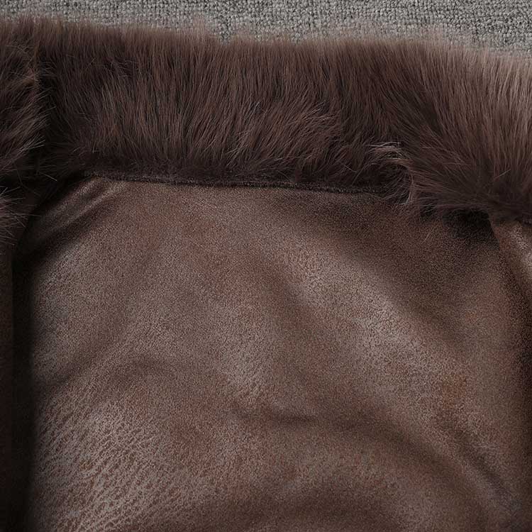 Interior view of a brown faux fur short jacket showcasing soft texture and cozy lining