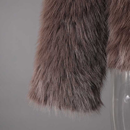 Brown faux fur short jacket with a soft texture, perfect for stylish layering in cooler weather