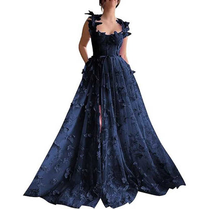 Elegant navy butterfly tulle prom dress with floral embellishments and flowing silhouette