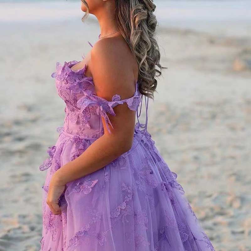 Lavender butterfly tulle prom dress with floral accents and off-shoulder straps for an elegant look