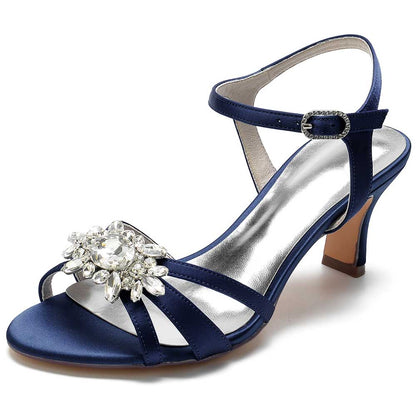 Navy chic strappy sandals for prom with a sparkling jewel accent and a modest heel