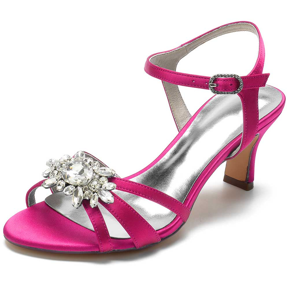 Chic strappy sandals for prom in vibrant pink with a sparkling jewel embellishment and a comfortable heel