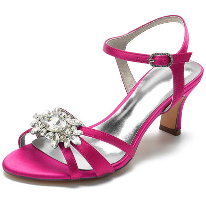 Chic strappy sandals for prom in vibrant pink with a sparkling jewel embellishment and a comfortable heel
