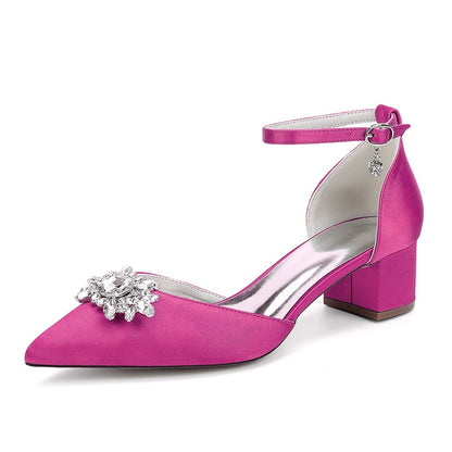 Stylish pink chunky heel ankle strap wedding shoes with a decorative floral embellishment