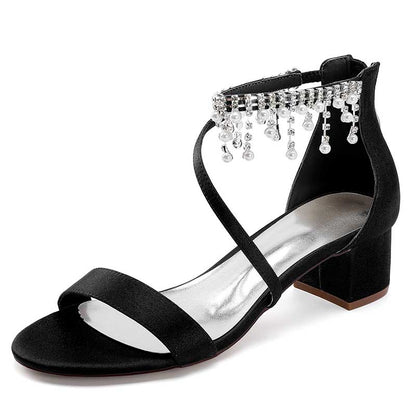 Elegant black chunky heel formal shoes with rhinestones featuring a stylish ankle strap