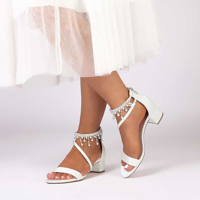 Elegant white chunky heel formal shoes with rhinestones, featuring a stylish ankle strap design