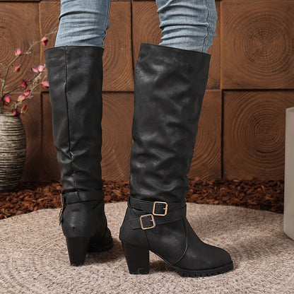 Stylish black chunky heel knee-high boots with buckles for a trendy look