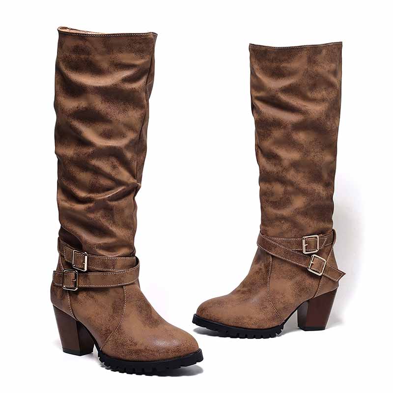 Stylish chunky heel knee-high boots in brown with buckle detail and slouchy design