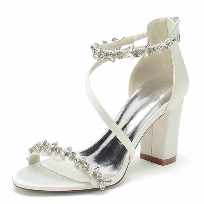 Stylish white chunky heel sandals for event with crystal embellishments and elegant straps