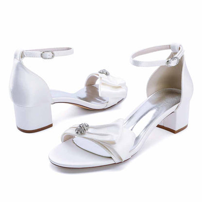Elegant sd-hk chunky heel wedding sandals in white with bow and rhinestone embellishment