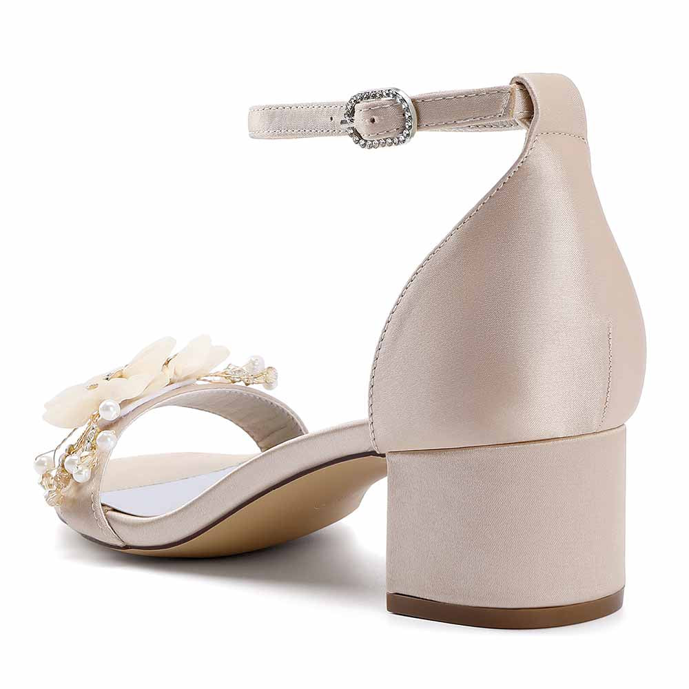 Elegant chunky heeled sandals for brides with floral accents and ankle strap in soft beige color