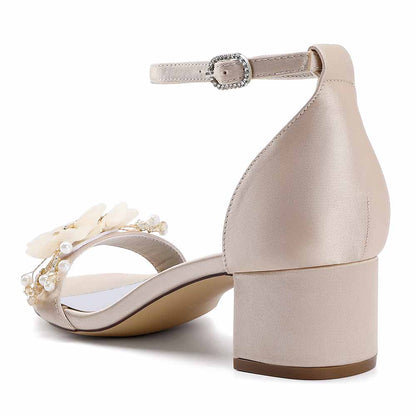 Elegant chunky heeled sandals for brides with floral accents and ankle strap in soft beige color