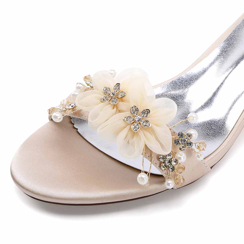 Elegant chunky heeled sandals for brides featuring floral embellishments and pearl accents