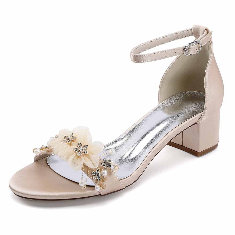 Elegant chunky heeled sandals for brides featuring floral embellishments and ankle strap design