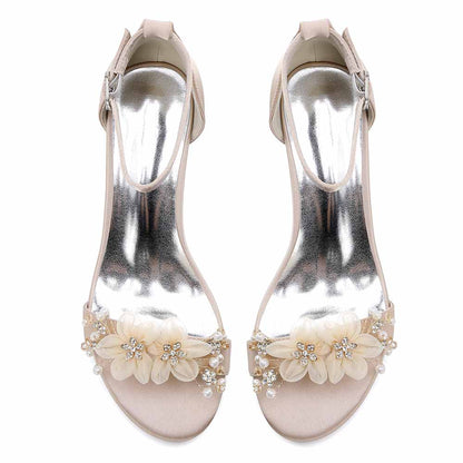 Elegant chunky heeled sandals for brides featuring floral embellishments and a sleek metallic finish