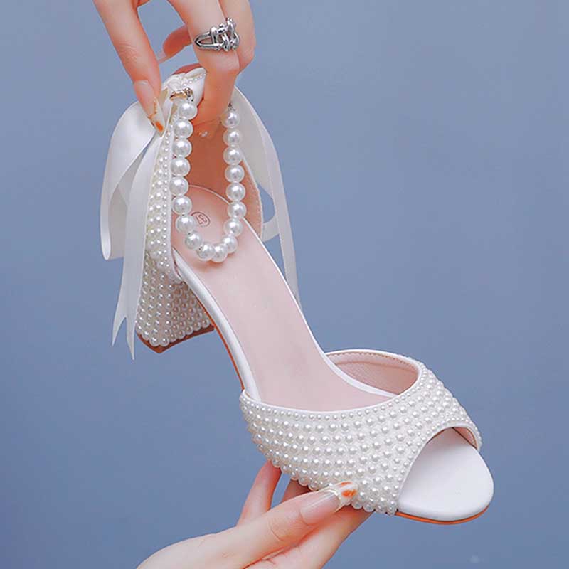 S&DCo. chunky lace up bridal shoes in white with pearl embellishments and ribbon details