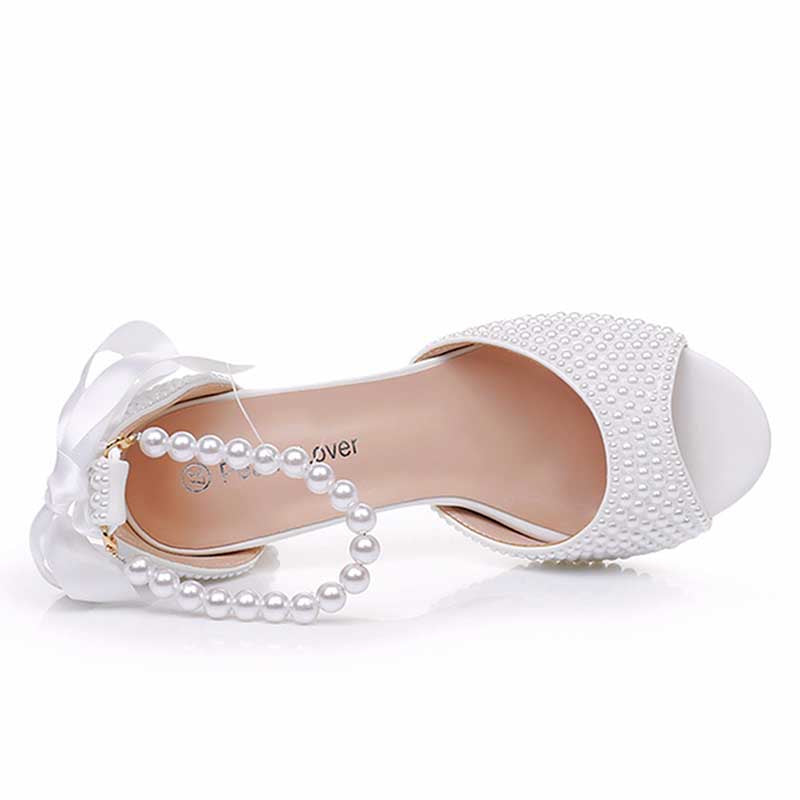 S&DCo. chunky lace up bridal shoes with pearl embellishments and a decorative bow for elegant weddings