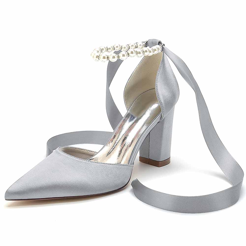 Elegant closed toe lace up bridal shoes in silver with pearl detailing and stylish ankle ribbons