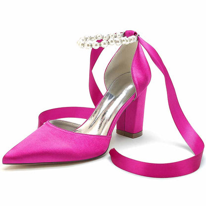 Closed toe lace up bridal shoes in pink satin with a pearl detail and high heels