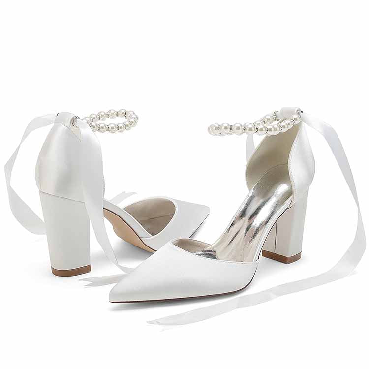 Closed toe lace up bridal shoes with pearl straps and block heels in elegant white