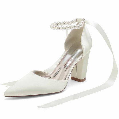 Elegant closed toe lace up bridal shoes with pearl detail and satin finish