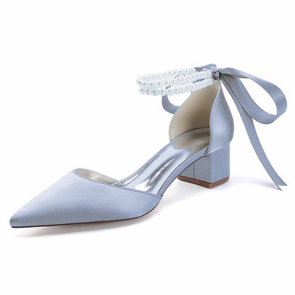 Stylish closed toe wedding heels for bride in light blue satin with pearl ankle detail