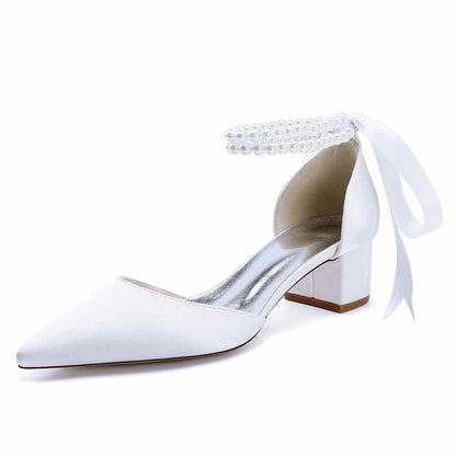 Elegant closed toe wedding heels for bride in white with ankle strap and pearl details