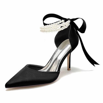 Elegant black closed toe wedding shoes with pearl details and ribbon ankle tie