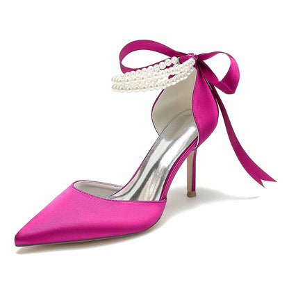 Closed toe wedding shoes in vibrant pink satin with pearl embellishments and elegant ribbon tie