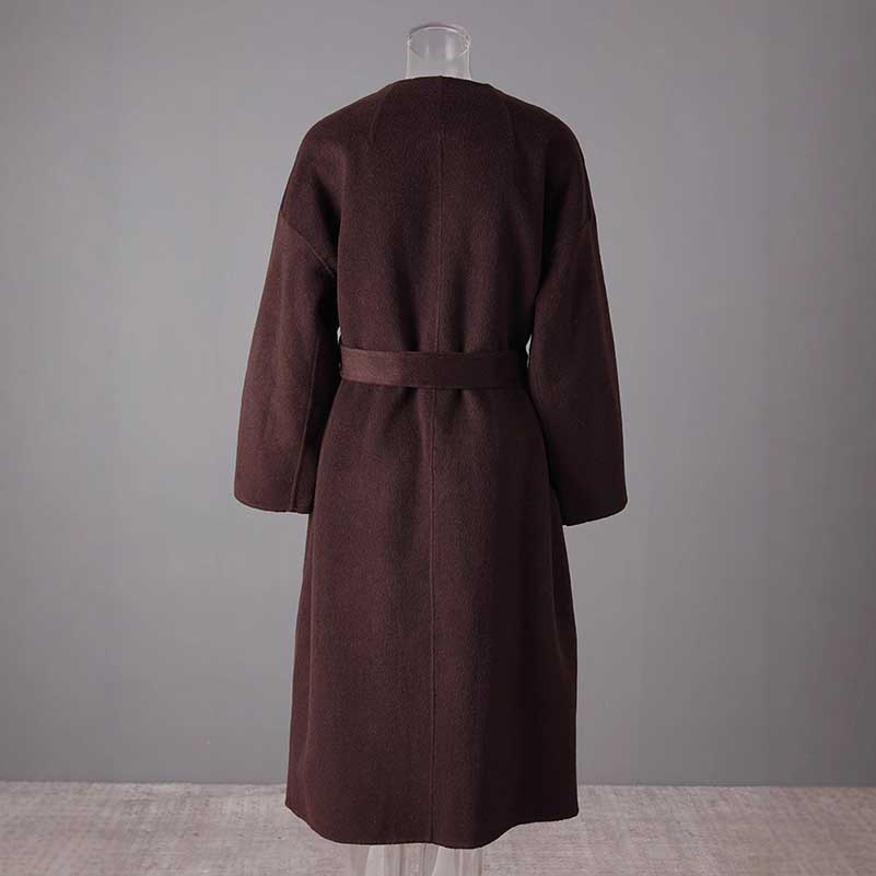 Back view of a collarless double belted cashmere coat in dark brown with a relaxed fit