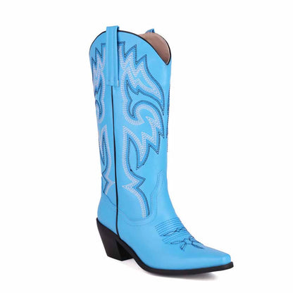 Colorful embroidered cowgirl boots in blue with intricate stitching and a pointed toe design