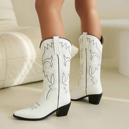 Stylish white cowgirl boots with colorful embroidered details, perfect for fashion-forward outfits