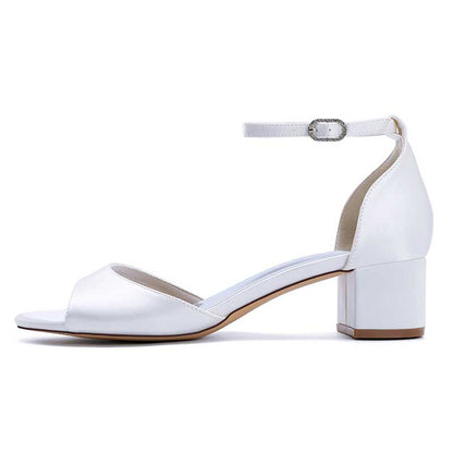 Elegant white comfortable block heel wedding sandals with ankle strap for stylish bridal looks