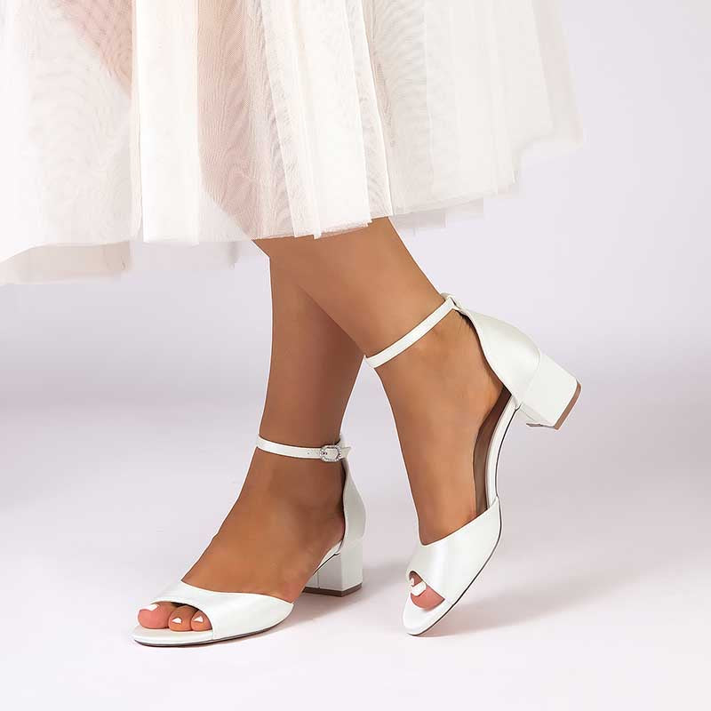 Elegant white comfortable block heel wedding sandals with ankle strap and open toe design