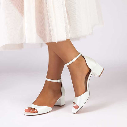 Elegant white comfortable block heel wedding sandals with ankle strap and open toe design