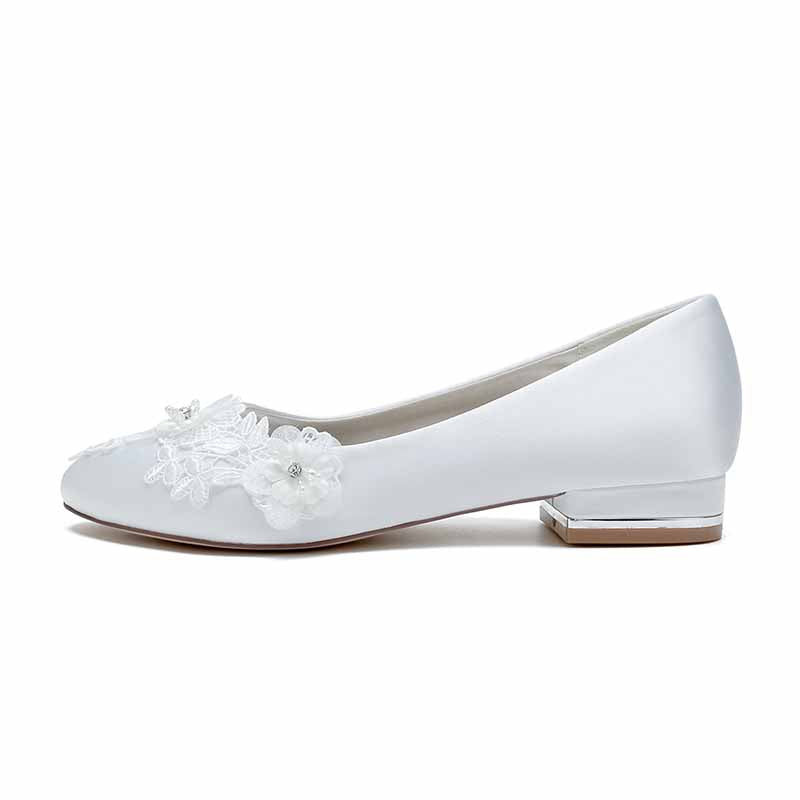 Elegant white comfortable wedding flats for bride with floral embellishments and a low heel